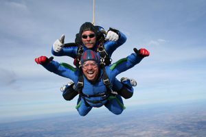 Tandem sky-jumping at 35,000 feet in the sky.